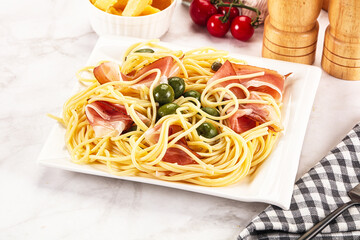 Pasta spaghetti with olives and jamon