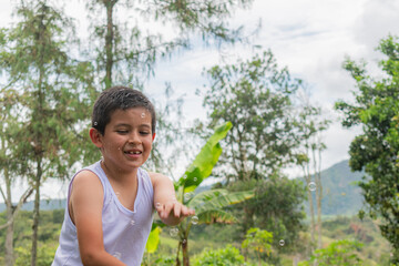 Portrait of a happy child playing outdoors