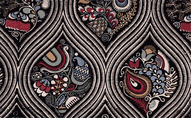 A vintage textile design featuring a pattern of stylized floral and paisley motifs in red, blue, yellow and green on a black background.