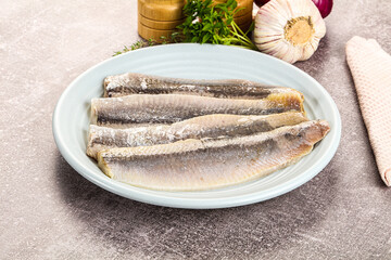 Marinated salted herring fillet apetizer