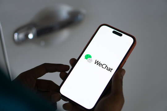 Dhaka,  bangladesh- 18 Sep 2024: WeChat  logo is displayed on smartphone.
