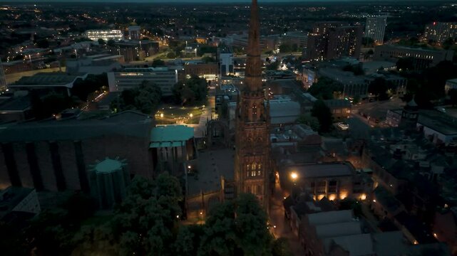 Coventry cathedral illuminating night skyline