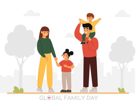 Portrait of happy family with two children walking at the park. Parents and kids having a good time