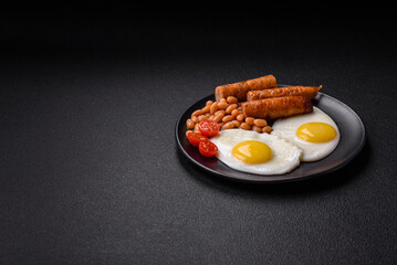 Full English breakfast with boiled eggs, beans, sausages, tomatoes