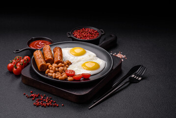 Full English breakfast with boiled eggs, beans, sausages, tomatoes