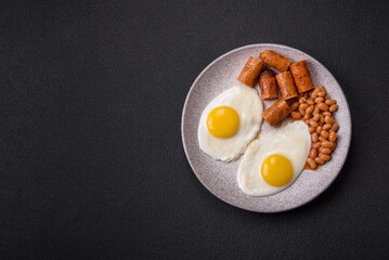 Full English breakfast with boiled eggs, beans, sausages, tomatoes