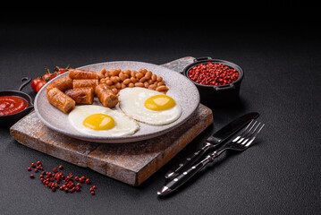 Full English breakfast with boiled eggs, beans, sausages, tomatoes