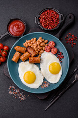 Full English breakfast with boiled eggs, beans, sausages, tomatoes
