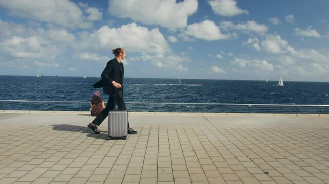 Tourist man with suitcase baggage in spain, A traveler with luggage suit jacket on business street go to a hotel, business office, airport terminal, enjoying the vibrant atmosphere