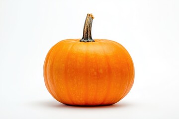 Obraz premium Bright Orange Pumpkin Against White Background