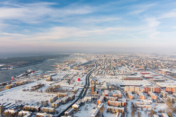Obraz premium Aerial view of Klaipeda city port area and it's surroundings on sunny winter evening. The Old town of Klaipeda, Lithuania in evening light at wintertime.