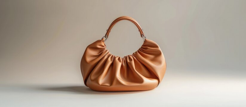 Elegant satin handbag with metallic accents and pleated design perfect for adding a touch of sophistication and high end style to any outfit  This accessory is perfect for formal events work