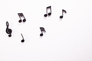 Music notes on white background. International music day. Flat lay. Copy space