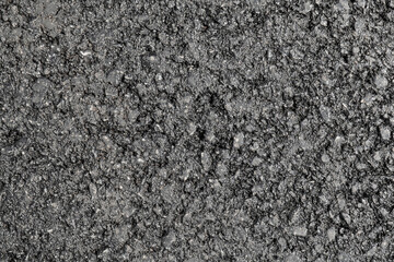 New asphalt texture. A frame filled with the textured surface of dry asphalt, showcasing the detailed pattern