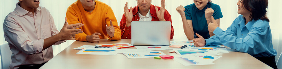 Excited and happy startup company employee celebrate after make successful strategic business...