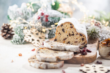 Christmas Stollen. Traditional Sweet Fruit Loaf with Icing Sugar. Xmas holiday table setting.