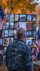 Obraz premium Veteran Reflecting on Military Service at Outdoor Veterans Day Display with Flags and Memorabilia