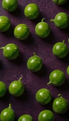 Fresh green peas on a vibrant green surface.