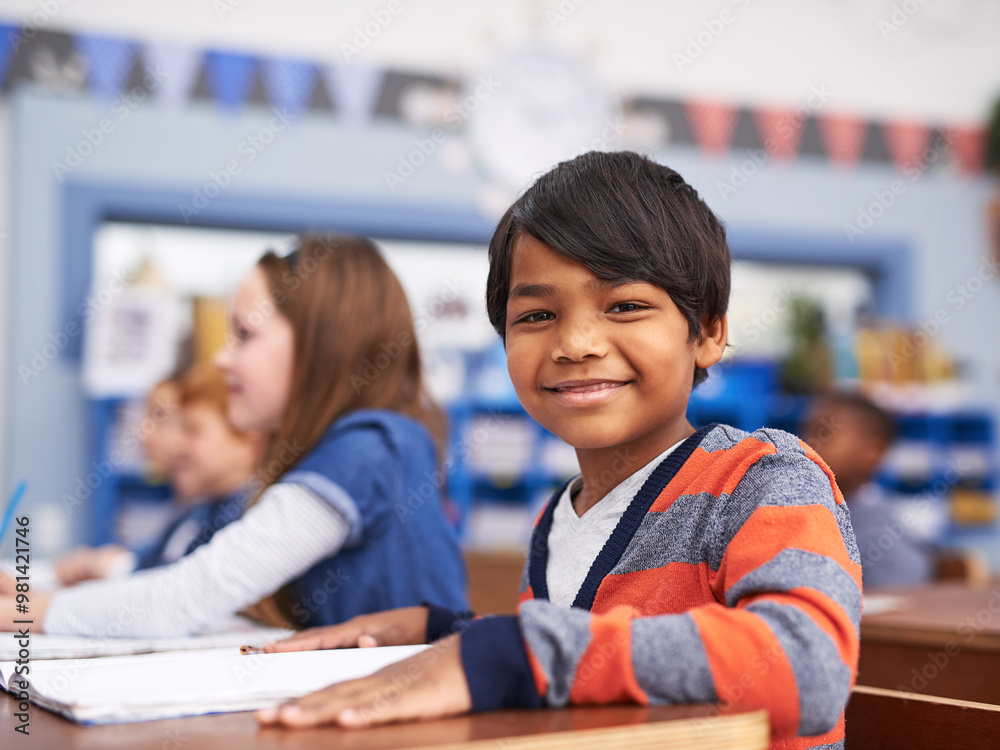 Poster Portrait, happy and boy in classroom for lesson in growth, child development and notebook for education. Smile, learning and face of student with exam notes, knowledge and study at elementary school