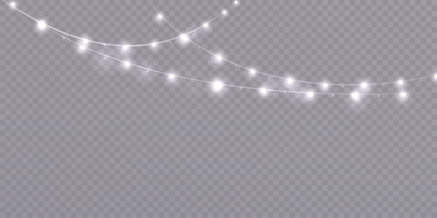 Garland of Christmas lights. Festive bright white lights of bulbs. Christmas light garland isolated on transparent background with glitter. For New Year and holiday design.