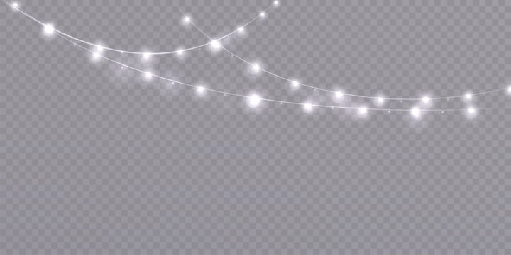 Garland of Christmas lights. Festive bright white lights of bulbs. Christmas light garland isolated on transparent background with glitter. For New Year and holiday design.