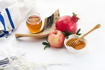 Rosh Hashanah Symbols. Traditional Rosh Hashanah items including pomegranate, apple, honey, and shofar