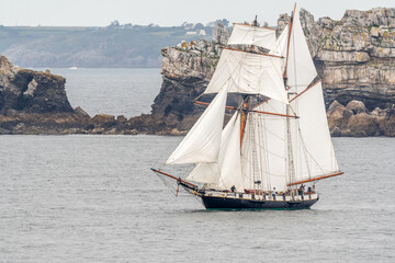 Large traditional sailing boat in a bay on the Atlantic Ocean during the Camaret sur mer sail festival.