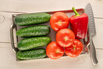 Fresh ripe vegetables on wooden table, macro, top view.