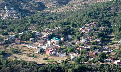 Obraz premium Imouzzer Ida Ou Tanane, Morocco : cityscape of Imouzzer, with mountains in the background.