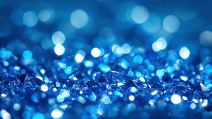 Abstract close-up shot of sparkling blue crystals with blurred bokeh background.