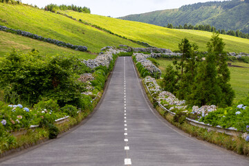 Empty road with beautiful green landscape. Sete Cidades, Sao Miguel island, Azores, Portugal