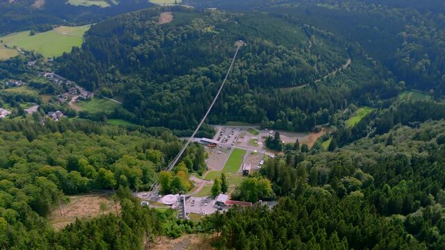Aerial drone footage of Skywalk Willingen, the longest suspension bridge in Germany, located close to Winterberg in Sauerland