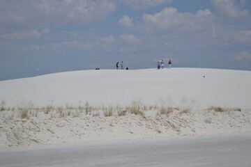 Tourists Walking on White Sand Dunes under Blue Sky at White Sands National Park