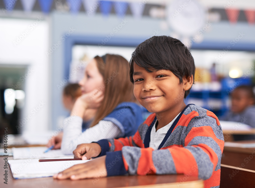 Poster Portrait, smile and boy in classroom for education in growth, child development and notebook for lesson. Happy, learning and face of student with exam notes, knowledge and study at elementary school