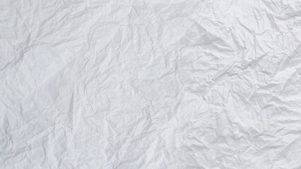 Crumpled white paper background.