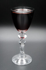 Cherry tincture in a glass, alcohol.

