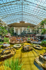 Luxurious Indoor Garden Atrium with Dining Midday Perspective