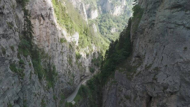 Camera moving forward over bicaz gorge revealing winding road