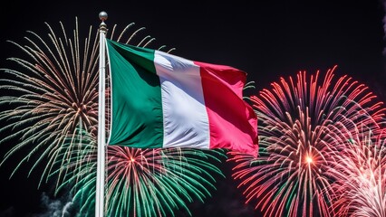 The Italian flag, proudly flying on a flagpole in the foreground, and an impressive fireworks display in the night sky.
