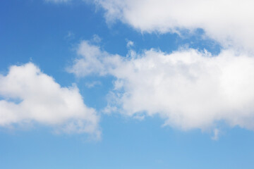 A Beautiful Bright Blue Sky Filled with Fluffy White Clouds Floating Gracefully Above