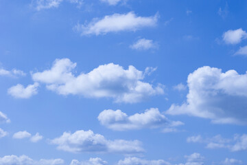 Fototapeta premium A Serene and Beautiful Blue Sky, Vastly Decorated with Fluffy, White, Cumulus Clouds Above