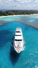 Fototapeta premium This stunning yacht glides through the vibrant turquoise sea, showcasing a serene escape amidst palm trees and rocky shores under bright sunlight