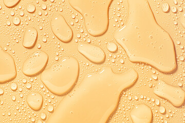 Cosmetic orange swatch of face cleansing water, tonic or wash soap foam cleansing gel isolated on...