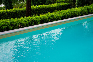 Swimming pool with blue water. Summer relax concept.