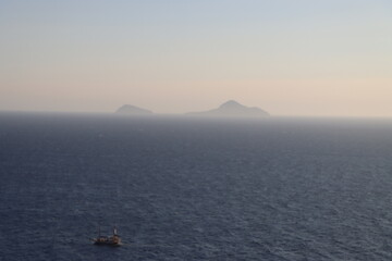 Fototapeta premium Mountainous Landscape of Greece, Cliffs and Blue Waters, Golden Hour, Greek Island, Travel, Vacation, Beautiful Landscape