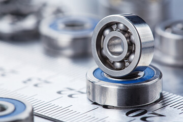Obraz premium different bearings on a metal background. Part of mechanism.
