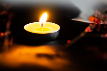 Defocused blurred background with burning candles.