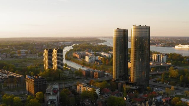 Aerial Riga, Latvia sunset cityscape of skyscrapers and traffic