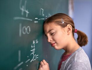 Kid, blackboard and girl in classroom, frustrated and stress with thinking, depression and anxiety....
