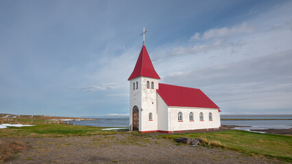 Fototapeta premium Lone church at the coast in the west fjords of Iceland